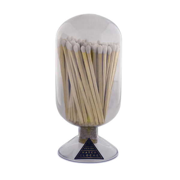 A clear glass container with a cork stopper, housing numerous lighted match sticks, designed to be used with a strike-on-bottle flint.